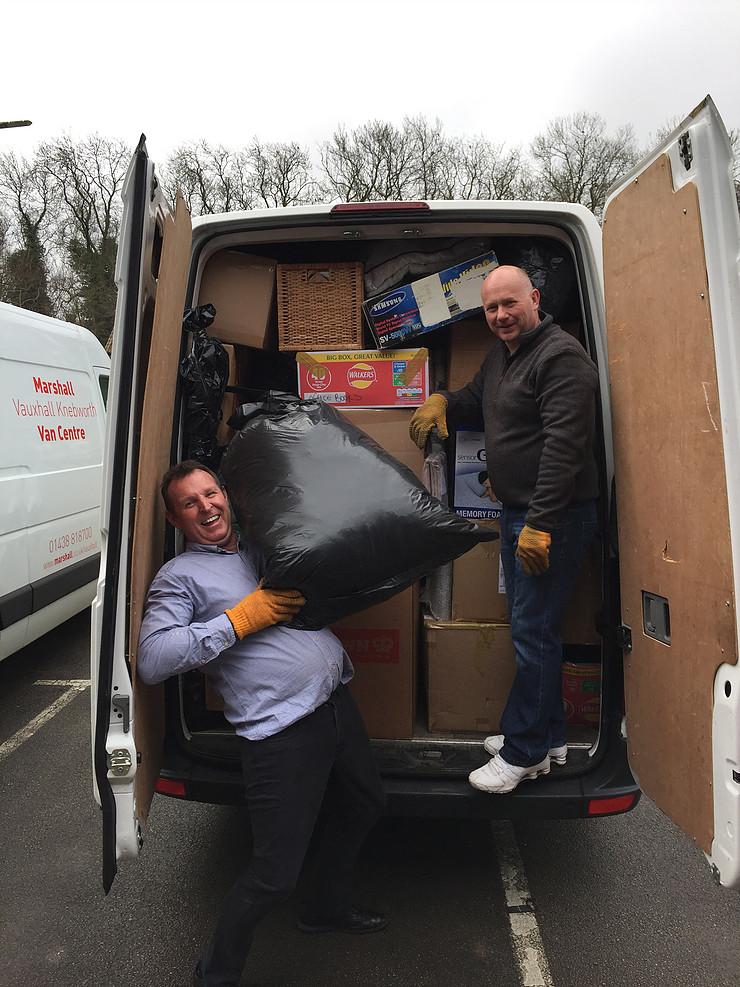 men unloading van