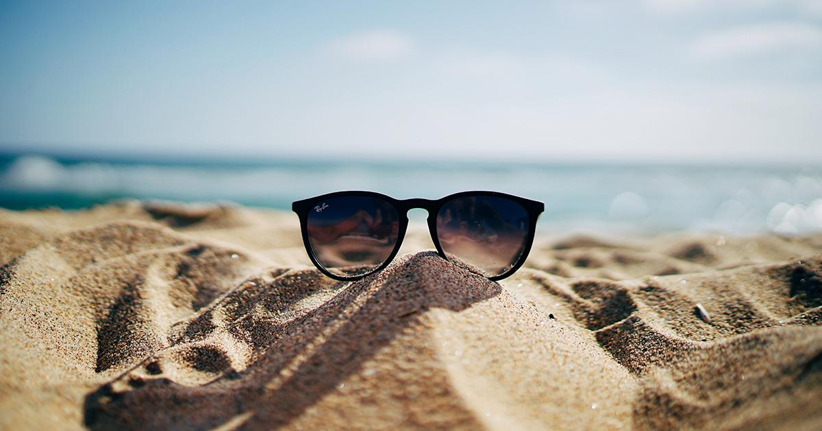 Sunglasses on beach in summer