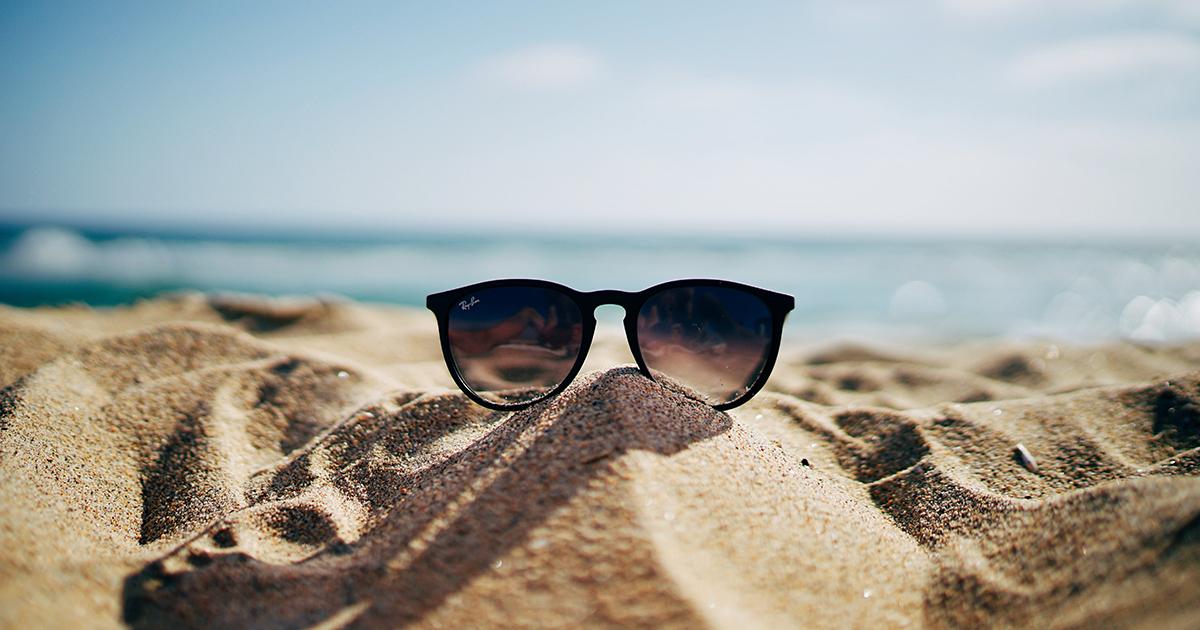 Sunglasses on beach in summer