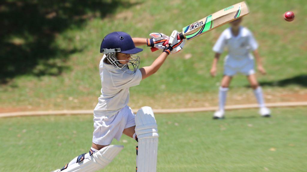 boy playing cricket