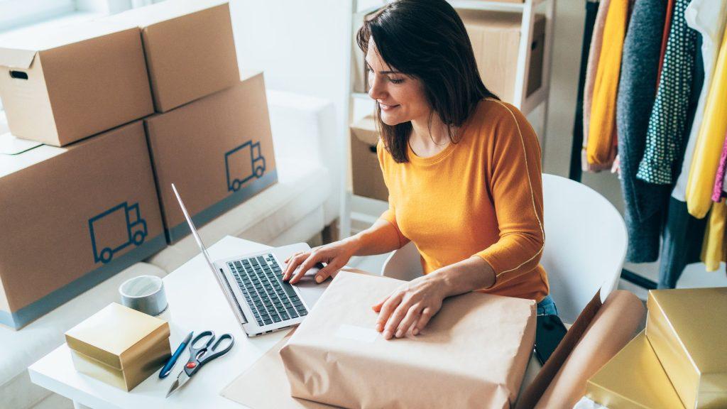 lady with laptop and box