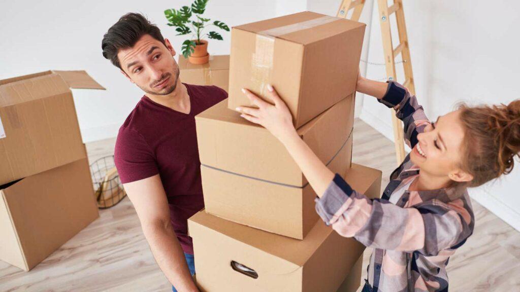 couple carrying boxes