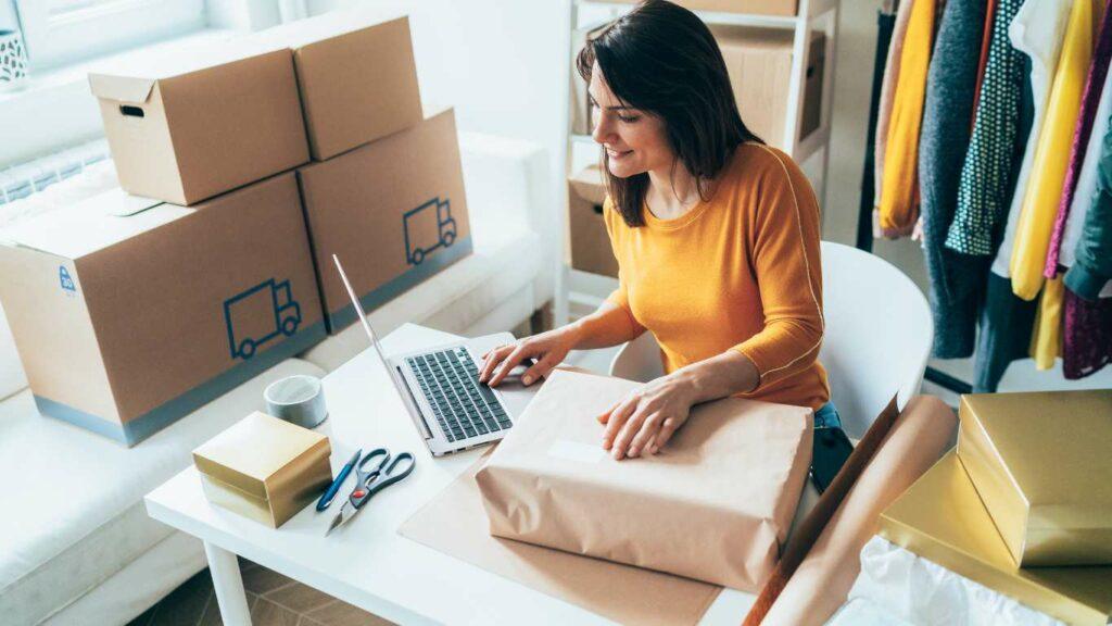 lady with laptop and boxes