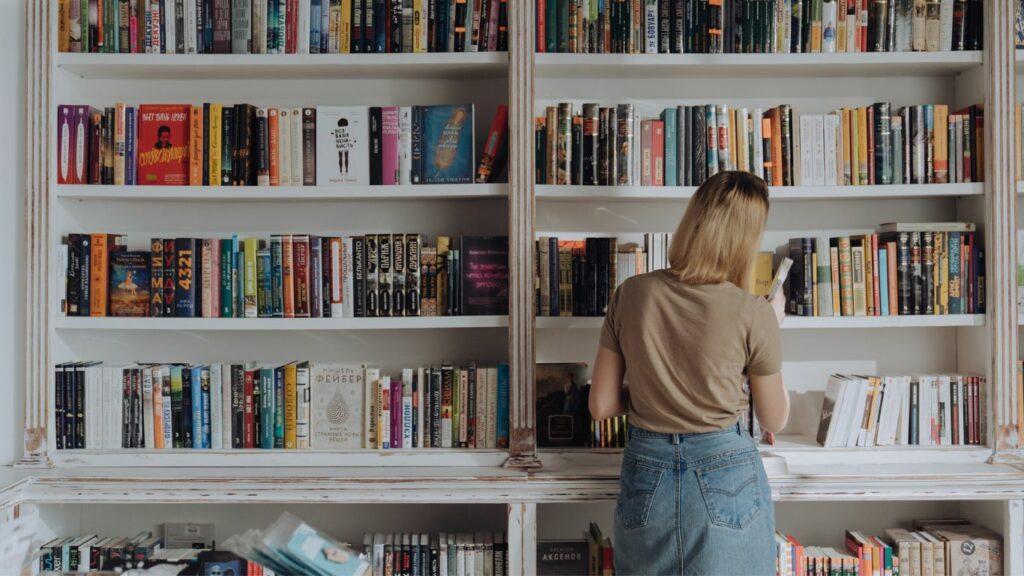 lady by book shelf