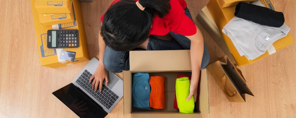 A woman preparing packages for delivery