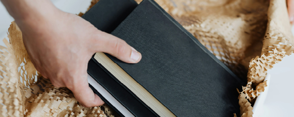 Books being packed for safe self storage