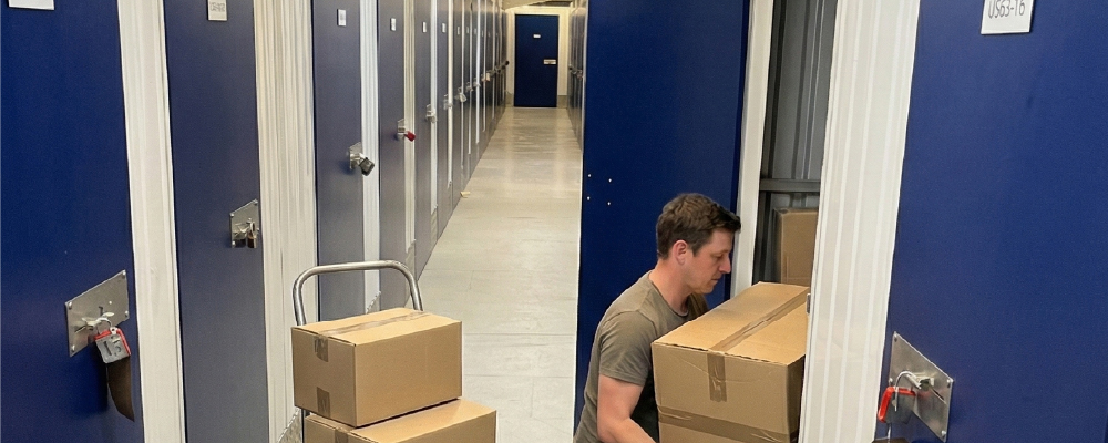 A man using a self storage space to store his personal items