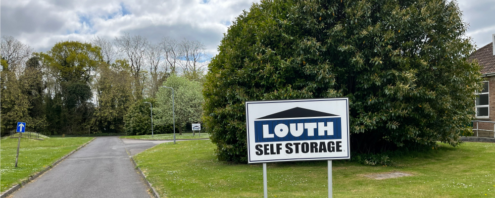 The entrance to Louth Self Storage featuring a white sign