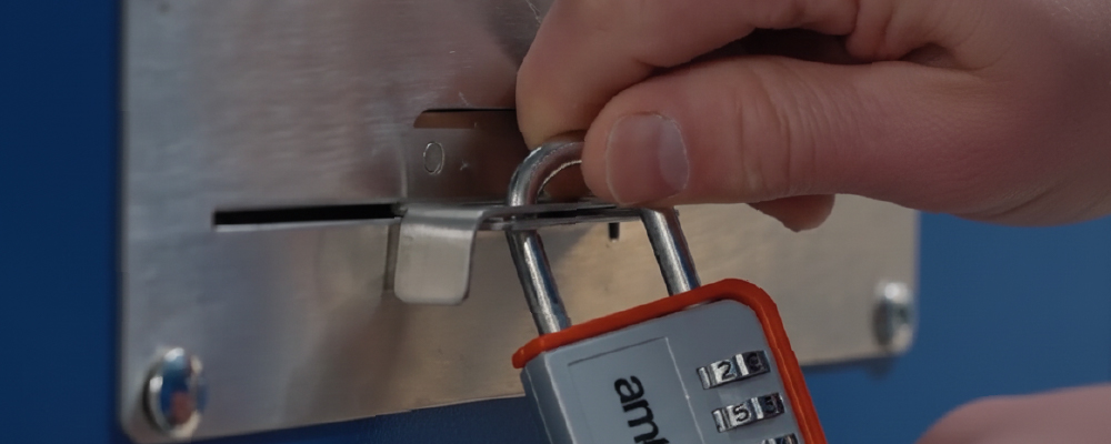 A customer securing their stroage unit with a padlock