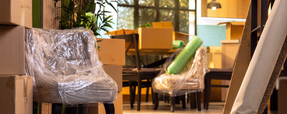 A customer's living room, with packed and wrapped up furnishings