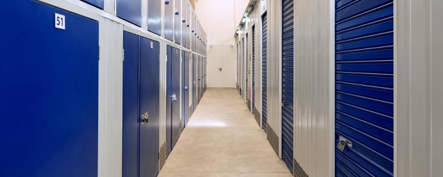 storage facility corridor with blue storage doors