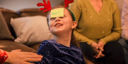 girl with sticker on head