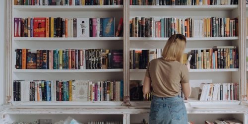 lady by book shelf