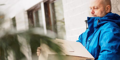 A business owner packing stock into a storage facility