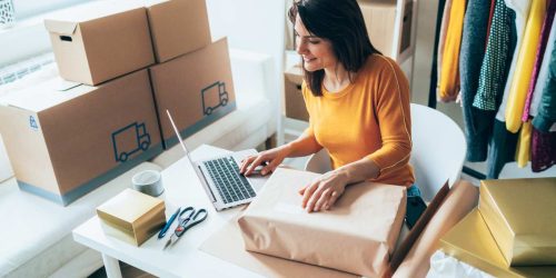 lady with laptop and boxes